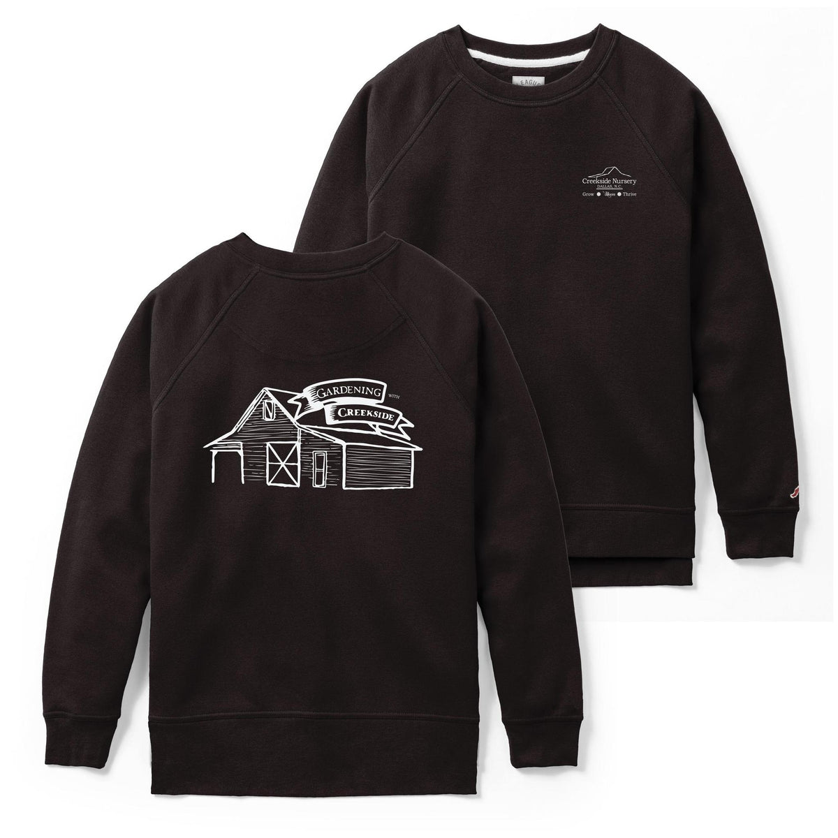 Black Creekside sweatshirt laid flat on a plain background