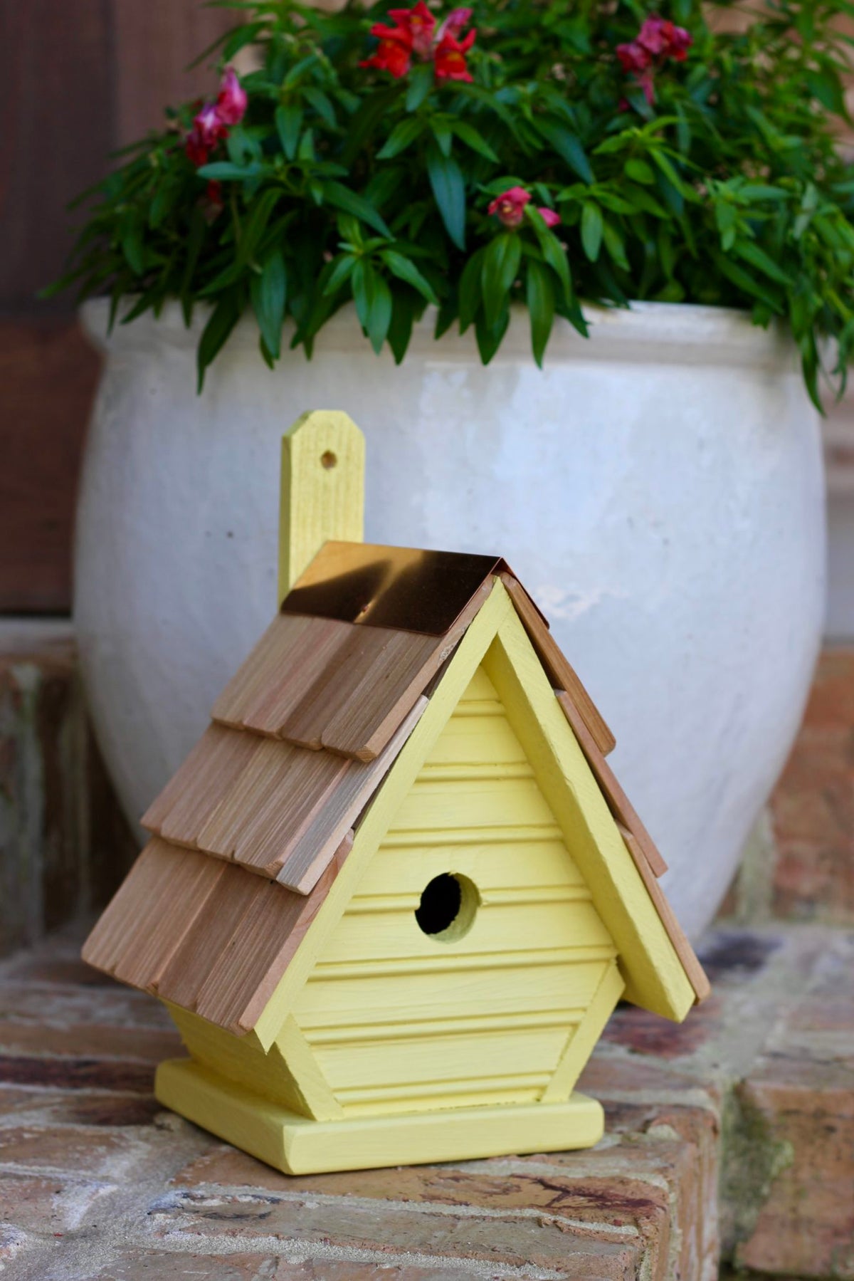Chick birdhouse with plant-themed design and hanging loop