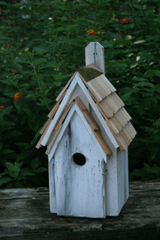 Bluebird Manor birdhouse with rustic wood finish