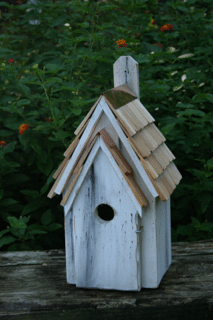 Bluebird Manor birdhouse with rustic wood finish