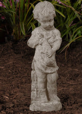 Boy with Rabbit stone sculpture of a boy holding a rabbit