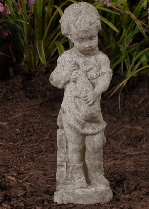 Boy with Rabbit stone sculpture of a boy holding a rabbit