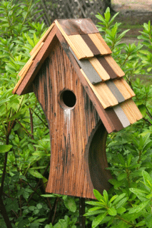 Nottingham birdhouse in a garden setting