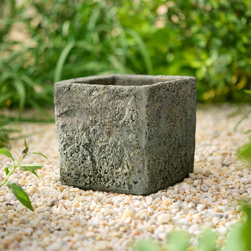 Small square stone planter with a textured finish
