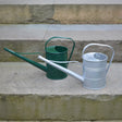 Mini watering can with a curved spout and handle