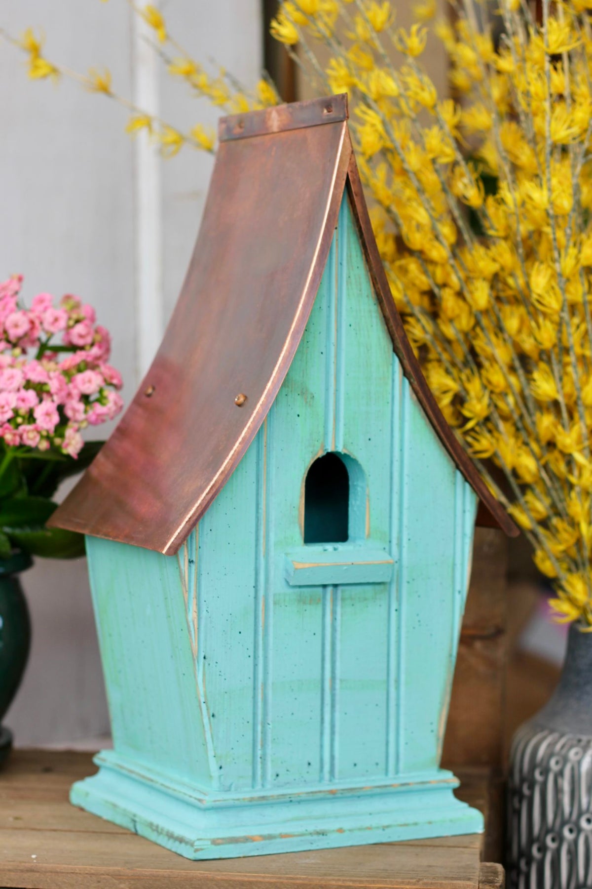 Airloom birdhouse in a hanging display cage