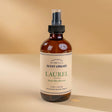 Laurel room spray bottle with label on a plain background